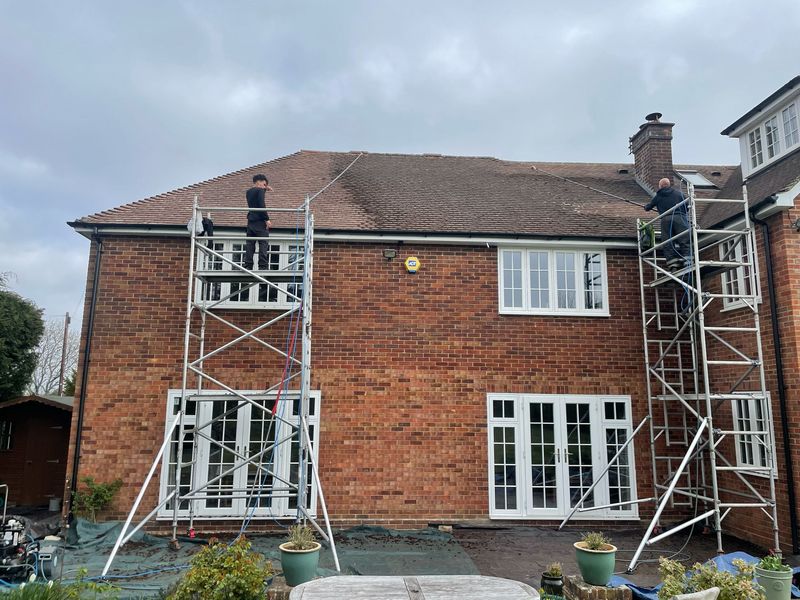 Roof cleaning carried out safely from scaffold towers by The Roof Moss Cleaners in Andover
